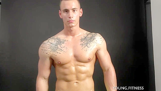 Glistening Muscle Worship: EastBoys Hunk Smothers His Ripped Abs in Oil, Arousing Viewers