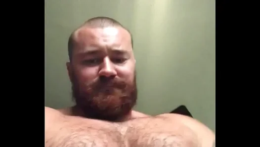 Flexing His Power: A Dominant Muscle Bear Showcases His Tattoos, Thick Muscles, and Hung